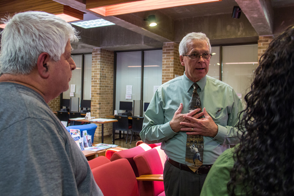 College of the Mainland President Warren Nichols talks with students.