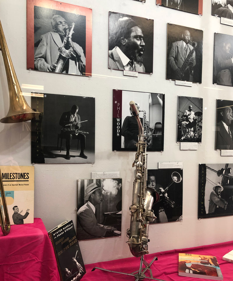 Black and white photos of jazz players in a display