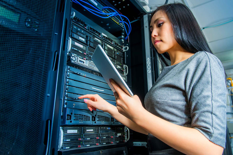 Asian woman working on computer servers