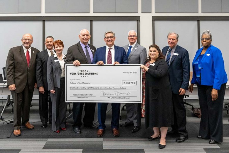 Board of Trustees receiving a large check.