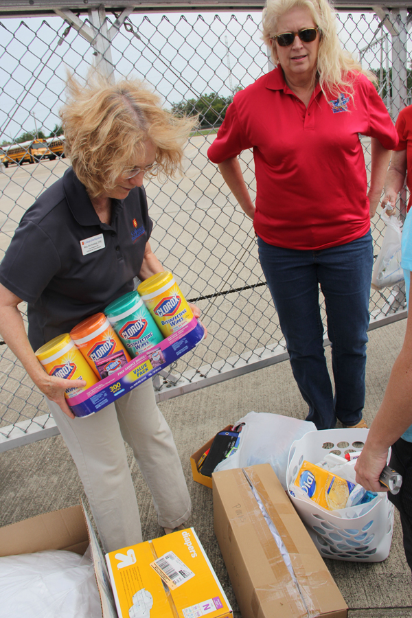 College of the Mainland employees donate supplies to the relief center in Dickinson. Pictured, Mary Ann Amelang, left, and Denese Angelle.
