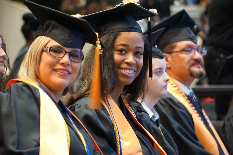 Rose Pipkin, left, and other COM 2017 graduates