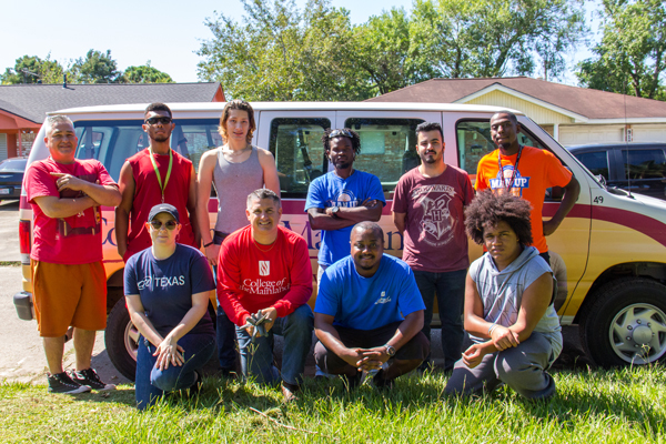 College of the Mainland staff and students help a nearby homeowner clean his home.