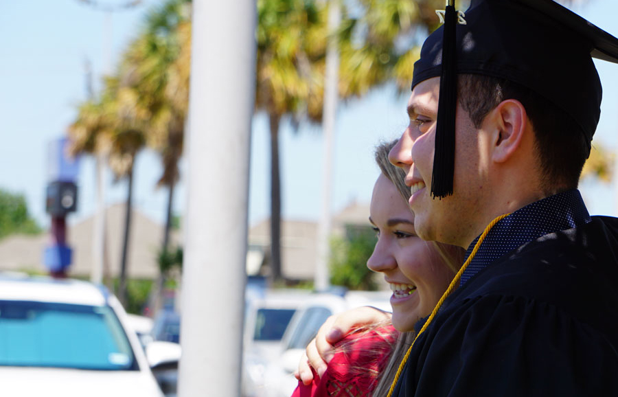 COM graduating student at commencement ceremony