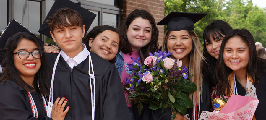 Group of students outside of graduation ceremony