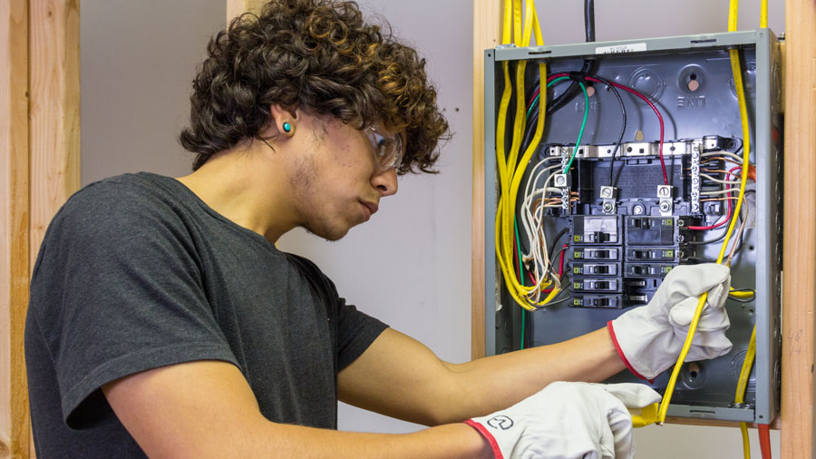 Student working on an electrical box