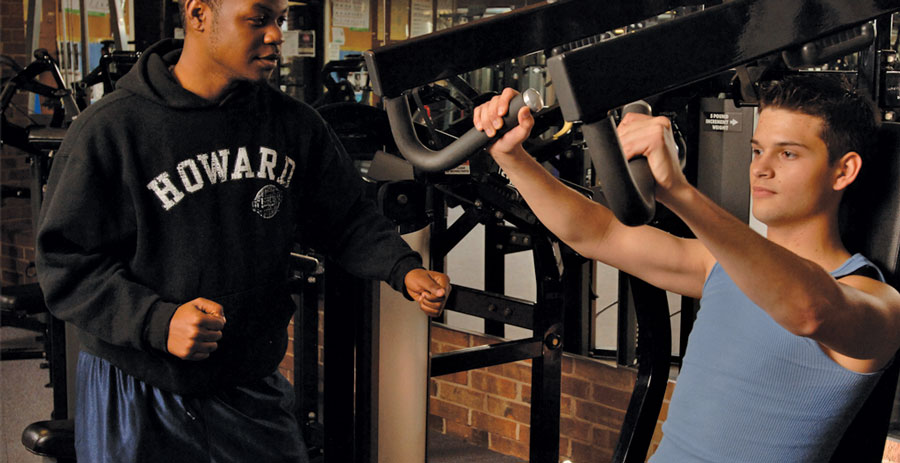 Students working out in the COM gym